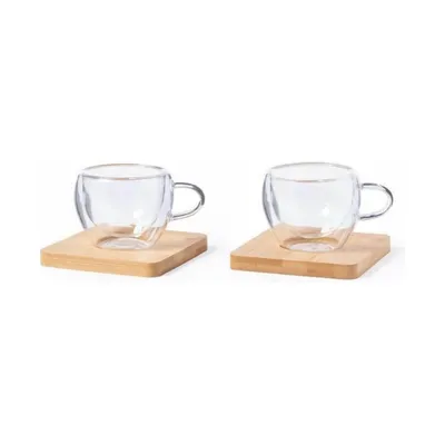 Two espresso cups with a bamboo coaster