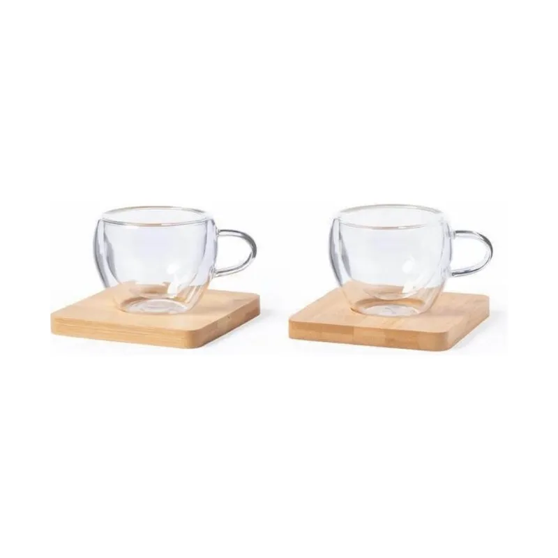 Two espresso cups with a bamboo coaster