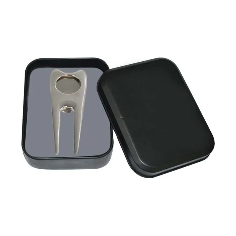 Divot tool and ball marker in a tin box